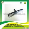 green painted metal hay rake