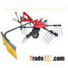 Tractor mounted hay raker