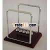 Wooden Newton's cradle with plastic stander