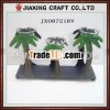 iron candleholder with coconut tree decoration