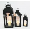 Set of 3 metal lantern with glass panels.