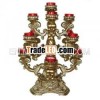 Resin tea light holder w/ 9 red glass cups for home decor.