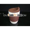 white ceramic mug with silicone sleeve and lid
